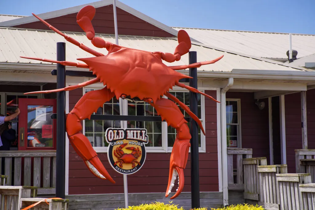 a giant crab statue in front of a restaurant